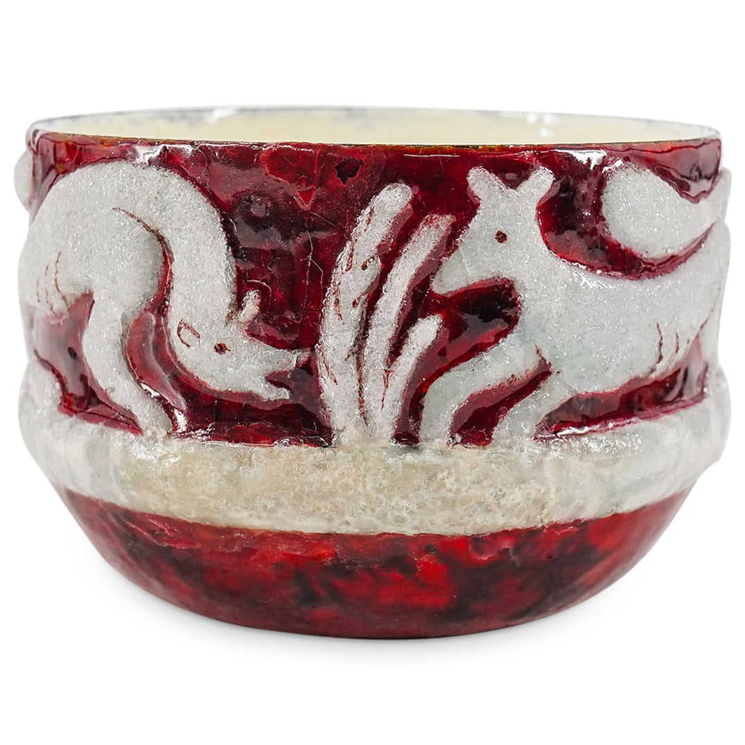 Jules Sarlandie (French, 1874–1966) For Limoges Enameled Bowl: DESCRIPTION: Enameled bowl by Robert Sarlandie for Limoges depicting raised white beasts among foliage against a red background. Signed on underside. CIRCA: 1890s-1930s ORIGIN: France DIMENSIONS: H: 3