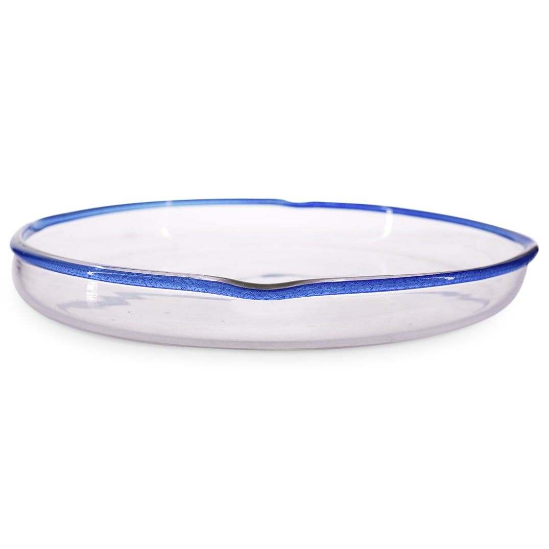 Daum Nancy Glass Pedestal Bowl: DESCRIPTION: Daum Nancy glass pedestal bowl featuring blue colored glass rim and a convex nodule at center. Marked on underside. CIRCA: Early - mid 20th century ORIGIN: French DIMENSIONS: H: 1.5" W: 1