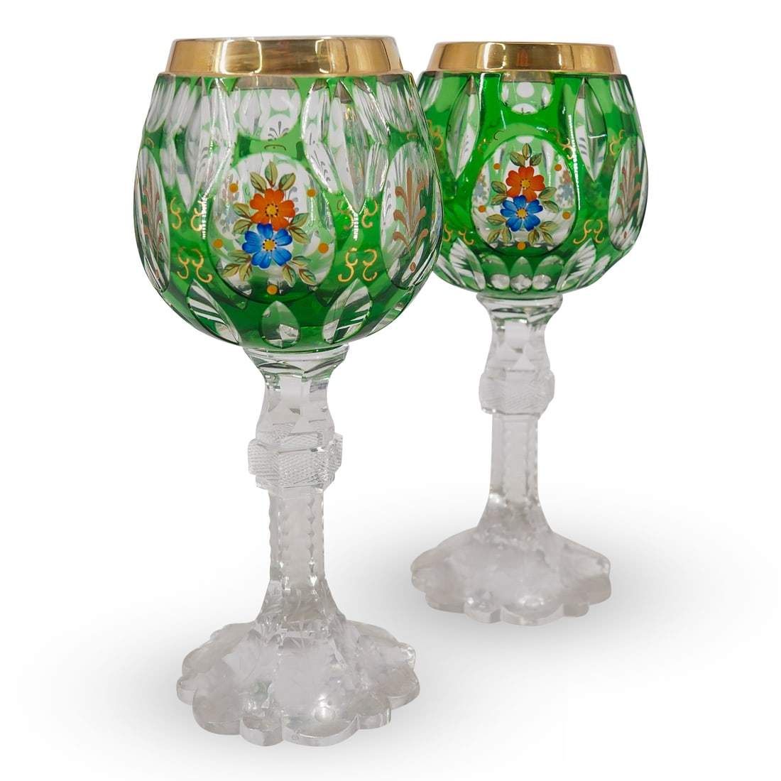 (2 Pc) Antique Bohemian Emerald Green Cut To Clear Stemware Glasses: DESCRIPTION: (2 Pc) antique Bohemian Emerald Green Cut To Clear Stemware Glasses. Further embellished with enamel floral hand painted motifs and gilt rim. This set includes two (2) wine glasses. CIRCA