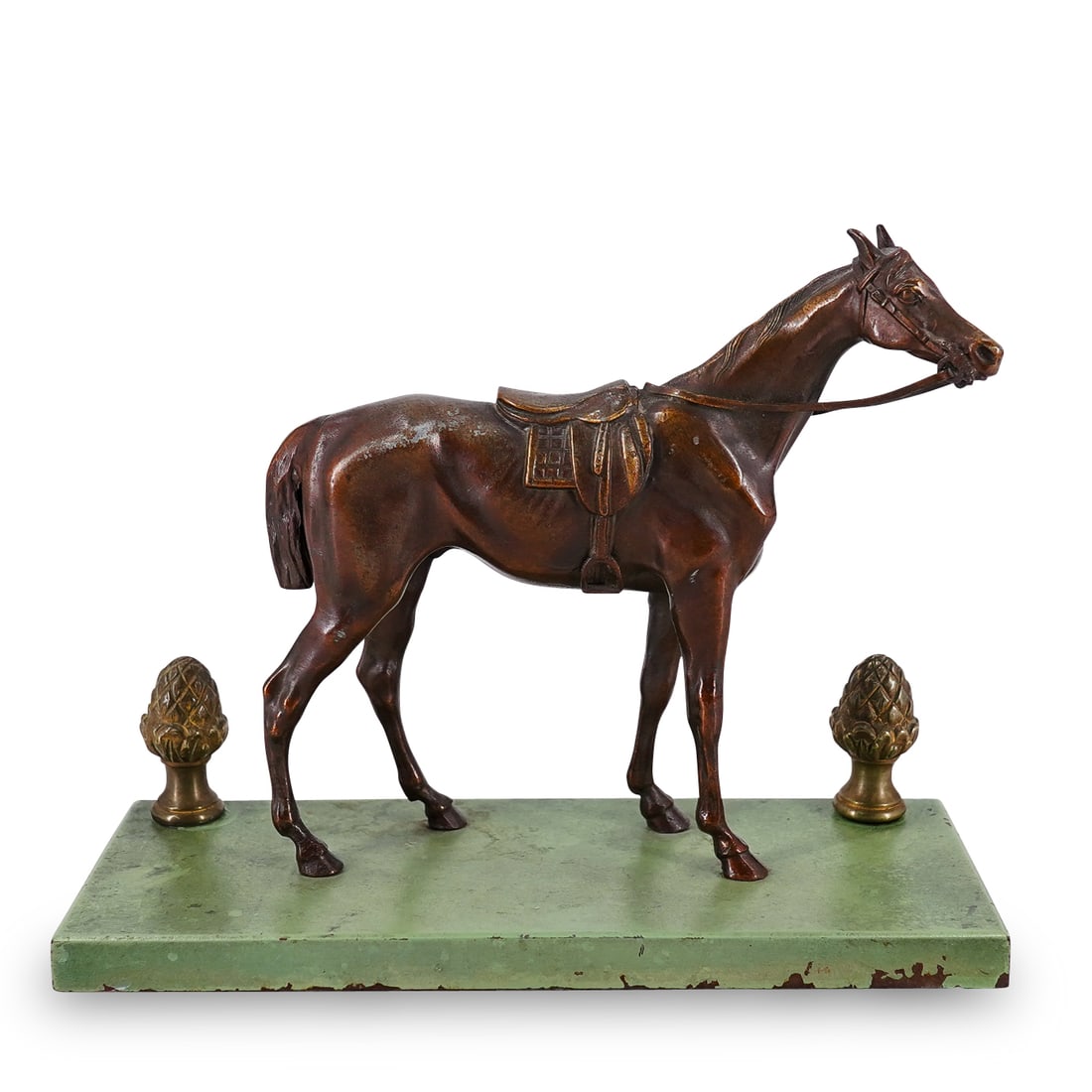 Metal Race Horse Sculpture: DESCRIPTION: Mixed metal sculpture of a race horse mounted atop a painted iron base. CIRCA: 20th century ORIGIN: - DIMENSIONS: H: 6.25" W: 3.25" L: 7.75" CONDITION: Pineapples have each received a rep