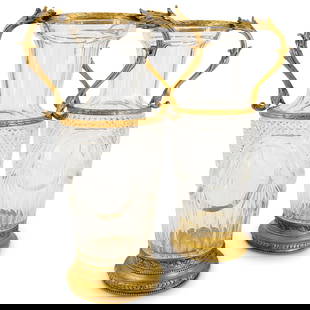 Pair Of Baccarat Crystal & Gilt Bronze Vases: DESCRIPTION: Two matching Baccarat vases, each featuring etched garden tool and floral motifs framed by garlands and lattice pattern. Each piece sports gilt bronze fasces and foliage form handles and
