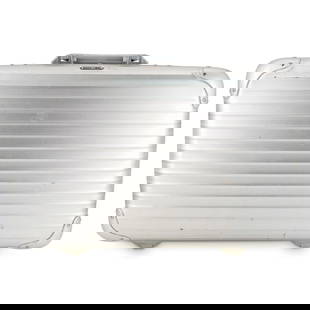 Rimowa x Porsche Design Aluminum Briefcase: DESCRIPTION: Vintage briefcase in aluminum by Rimowa for Porsche. Porsche logo on front with Porsche liner. Features storage compartment for pens and files, comes with original keys. CIRCA: Late 20th
