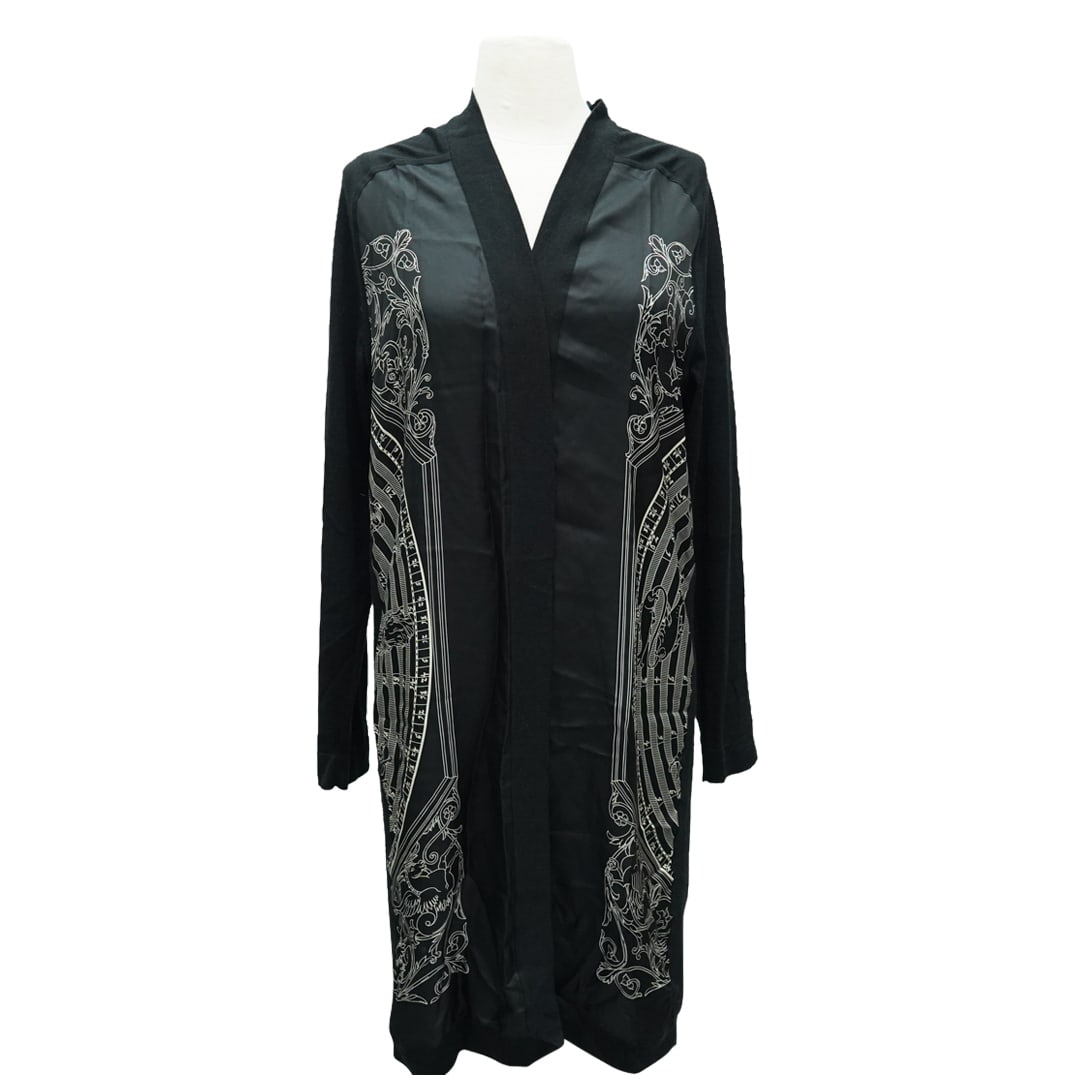 Hermes Astrology Twillaine Long Cardigan: DESCRIPTION: Hermes astrology finesse twillaine long cardigan in noir, size 34. 50% silk, 50% cashmere. Astrology wheel on back panel. CIRCA: 21st Cent. ORIGIN: Made In Italy DIMENSIONS: 40.5" Length