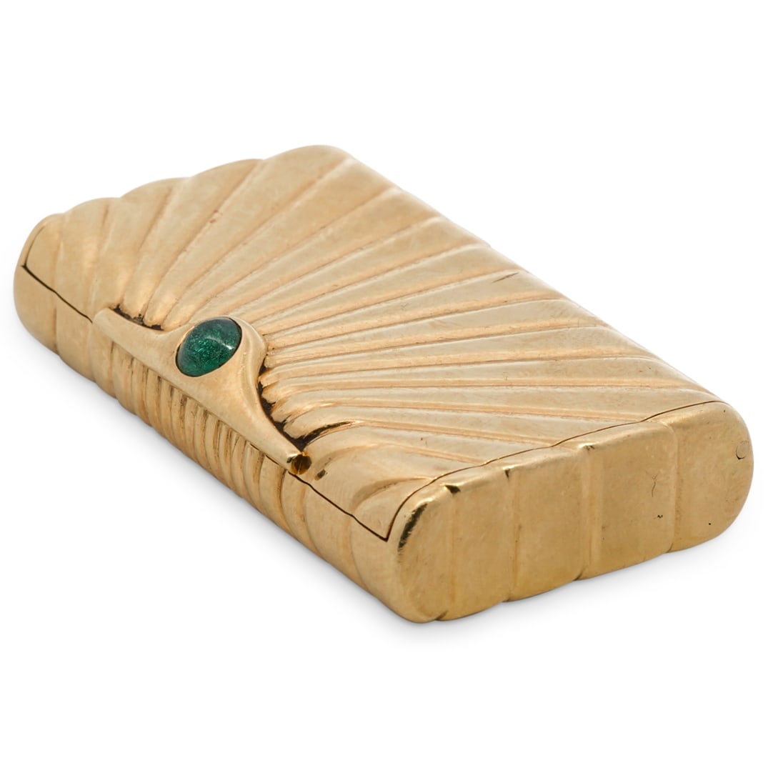 Antique 18K Gold English Pill Box: DESCRIPTION: An antique 18 karat yellow gold pill box in a sunburst pattern design finished with an .25 carat emerald cabochon at the clasp. English hallmarked on the interior. Weighs a total of 24.2