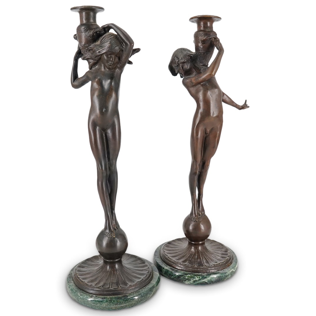 Edward Francis McCartan (American, 1879-1947) Bronze Figural Candlesticks: DESCRIPTION: Edward Francis McCartan (American, 1879-1947) Bronze figural candlesticks with rich brown patinas, depicting nude figures supporting amphoras, mounted to marble bases, each Inscribed 'E.