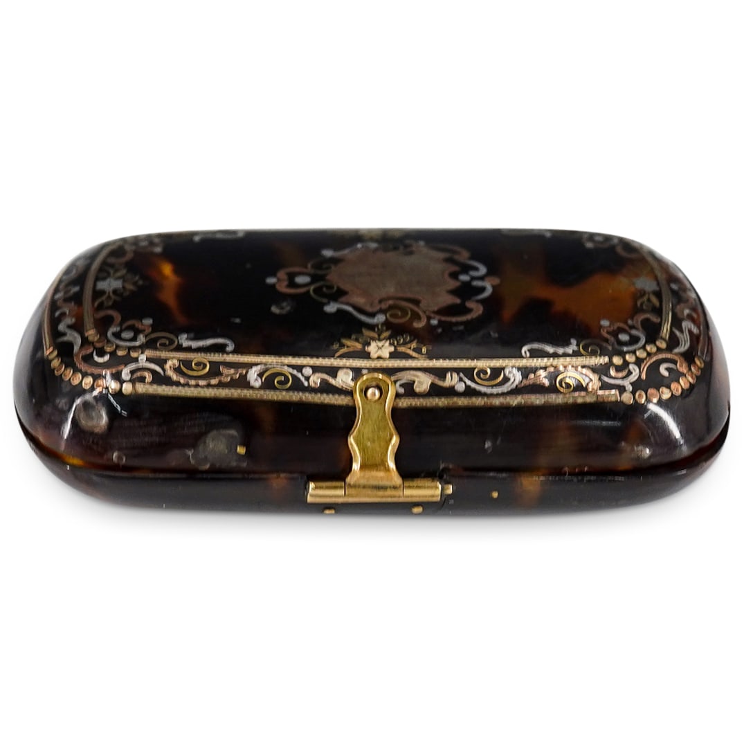 Victorian Tortoise Hued 14k Gold Inlay Case: DESCRIPTION: Victorian tortoise hued case with intricate 14k gold and silver inlay on one side, piece closes with a delicate gold clasp. Provenance: From a Palm Springs, California Collection. CIRCA: 