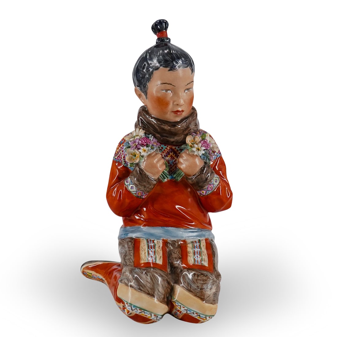 Royal Copenhagen Porcelain "Greenland Girl W/ Flower Bouquets" Figurine: DESCRIPTION: Royal Copenhagen Porcelain "Greenland Girl W/ Flower Bouquets" kneeling figurine. With glossy finish. Royal Copenhagen figurine of Greenlandic woman in national costume. By Carl Martin-Ha