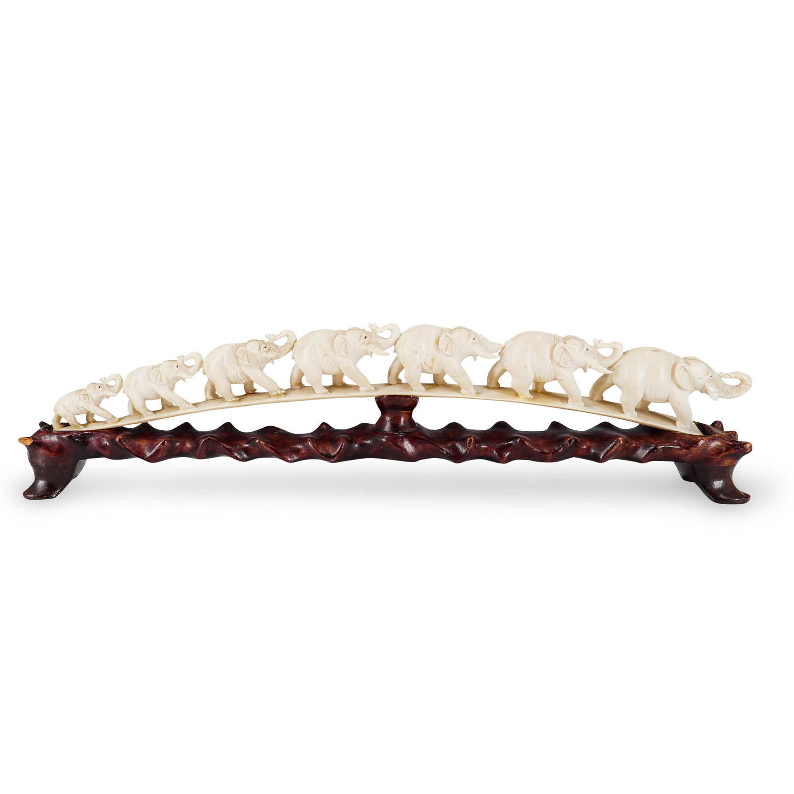 Antique Chinese Carved Bone Marching Elephants On Wood Base: DESCRIPTION: Antique carved bone sculpture depicting a train of marching elephants on a curved platform mounted on a carved wood base. CIRCA: Late 19th to early 20th Century ORIGIN: China DIMENSIONS: