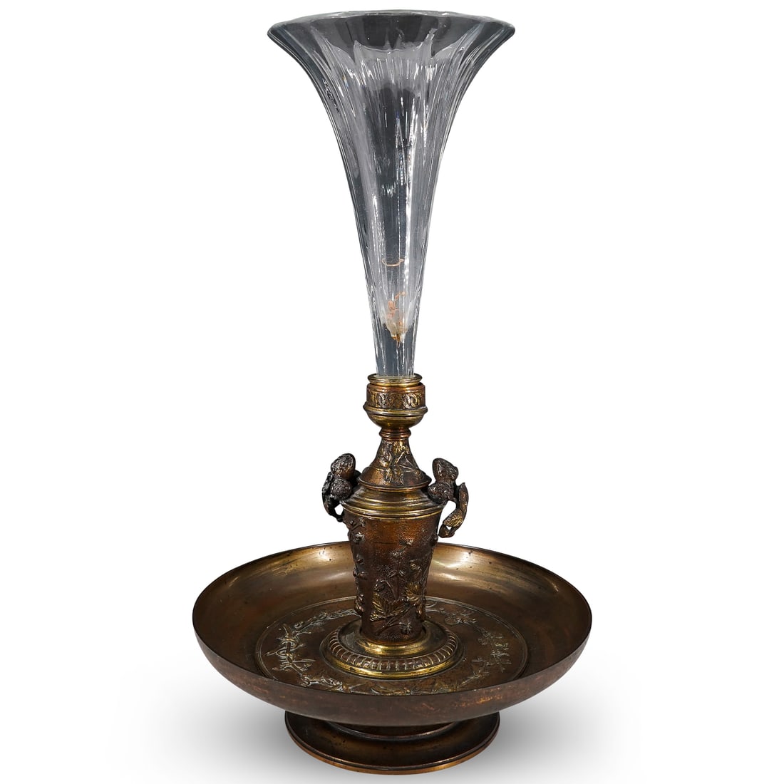 19th Century French Bronze And Crystal Centerpiece: DESCRIPTION: Antique CIRCA: 19th Century ORIGIN: France DIMENSIONS: H: 18.75" D: 11" CONDITION: Minor wear and tarnishing consistent with age and use Unless otherwise stated, all information provided 