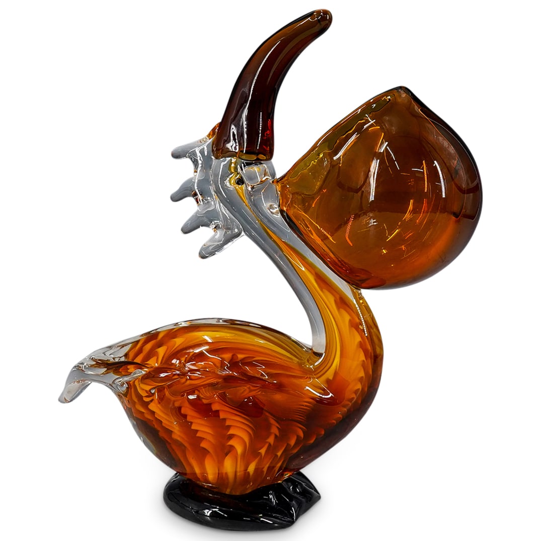 Vintage Murano Glass Pelican: DESCRIPTION: Vintage Murano glass sculpture depicting an open-mouthed pelican in white, amber, and clear glass. CIRCA: 20th Century ORIGIN: Italy DIMENSIONS: H: 10.25" W: 3.75" L: 8.75" CONDITION: Min