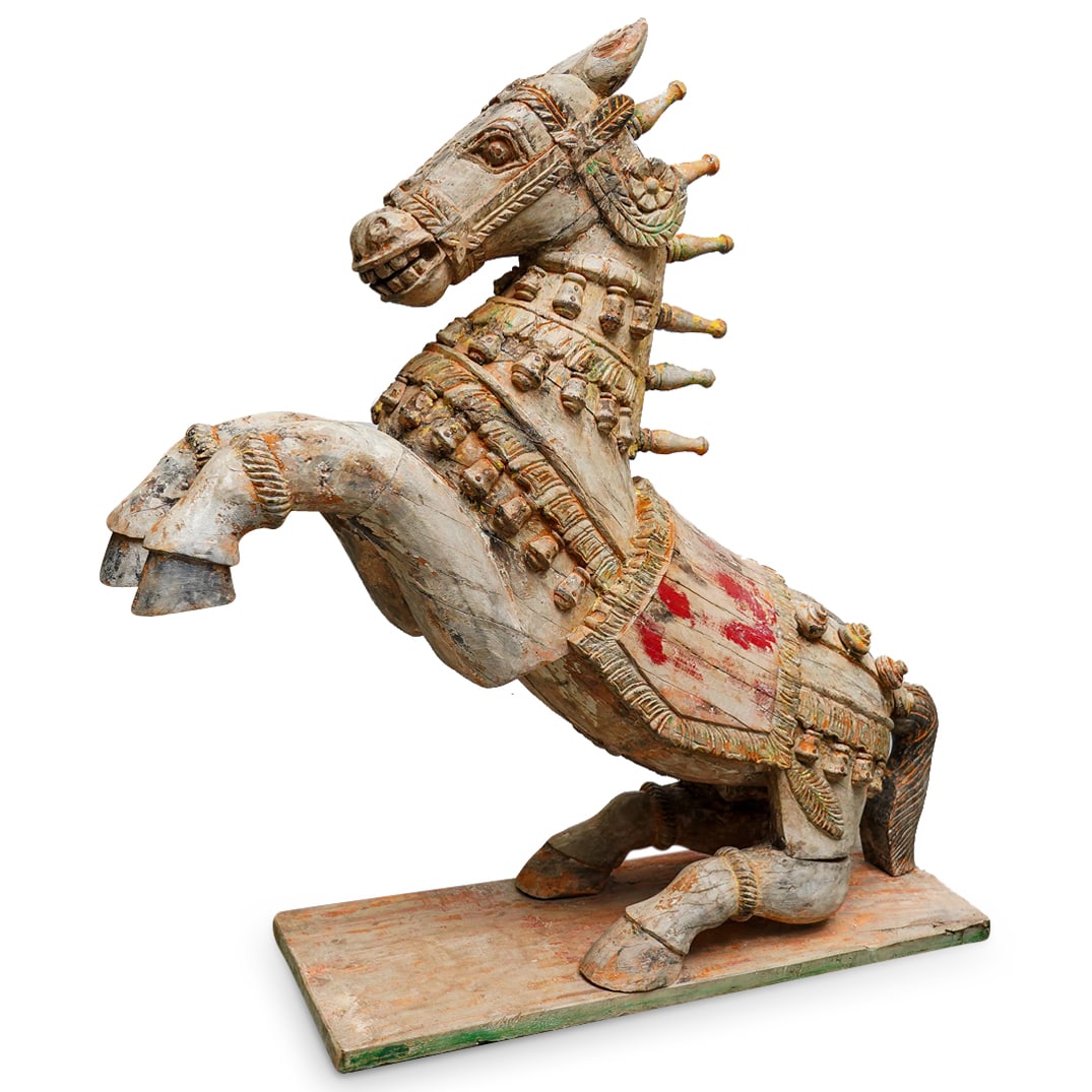 Antique Indian Carved Wood Polychrome Temple Horse: DESCRIPTION: Antique carved wood, polychrome temple sculpture depicting a horse rearing on its haunches and featuring balusters along its mane and bells and studs along its trappings. CIRCA: 19th Cent