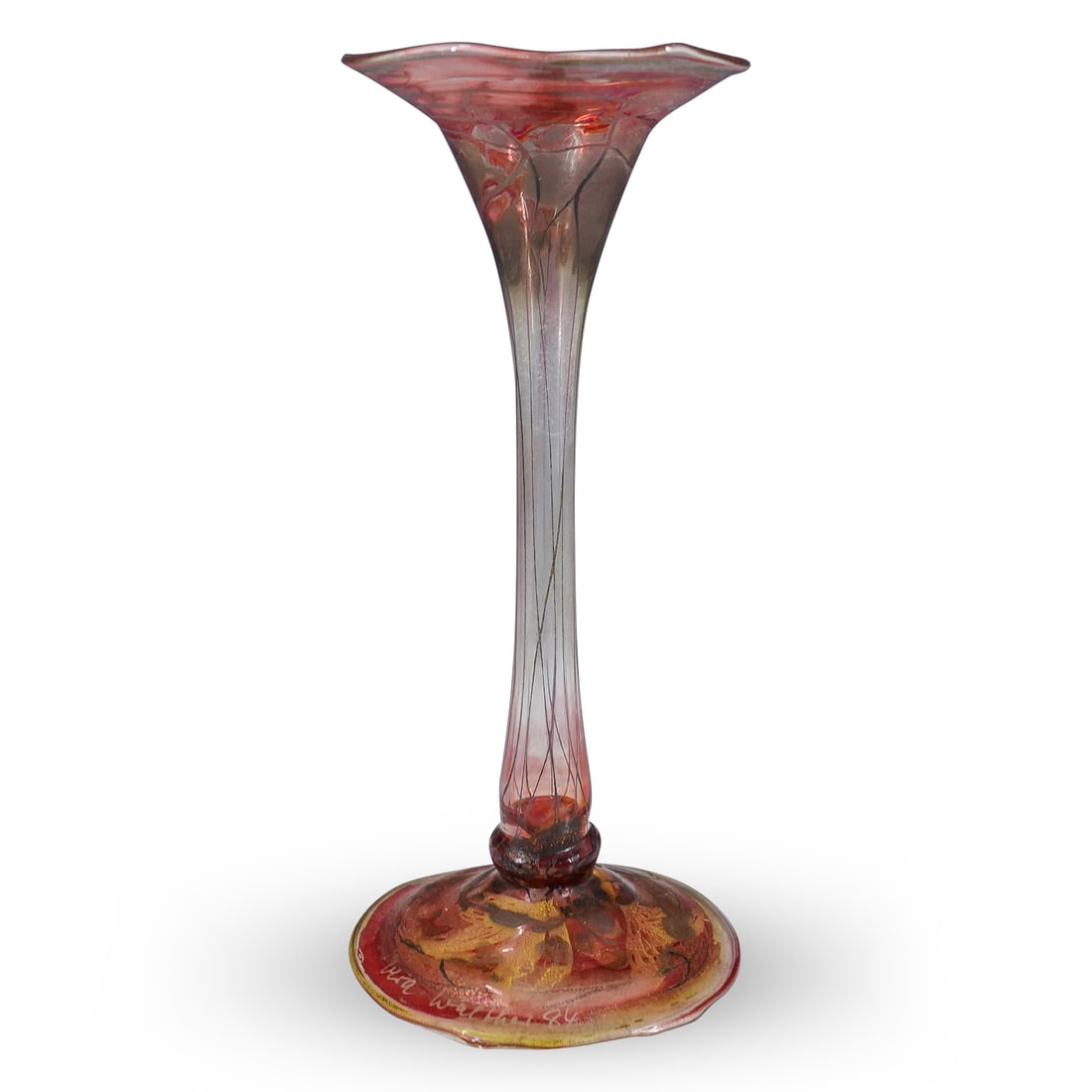 Vera Walther Art Glass Vase: DESCRIPTION: Vera Walther art glass bud vase with an elongated, thin center and flared top and bottom. Signed at the base "Vera Walther 84" CIRCA: 1984 ORIGIN: German DIMENSIONS: H: 8.125" W: 3.75" L: