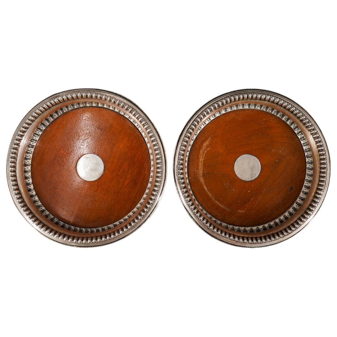 (2 Pc) Koch & Bergfeld Silver & Wood Wine Bottle Coasters: DESCRIPTION: Pair of 2 antique Koch & Bergfeld silver and wood wine bottle coasters, featuring repousse ribbed border. Marked on side with maker's mark, "12713" 800 silver. CIRCA: Early 20th Cent. ORI