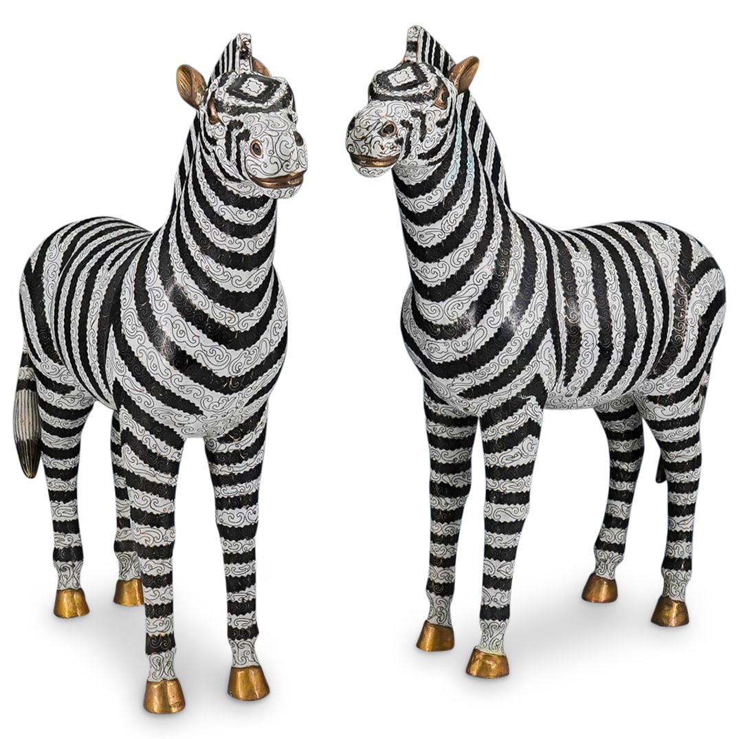Pair Of Antique Chinese Cloisonne Zebras: DESCRIPTION: Two matching cloisonne sculptures, each depicting a zebra - one leaning left, one right - sporting foliage and abstract designs throughout its stripes, mane, and face. CIRCA: Late 19th to
