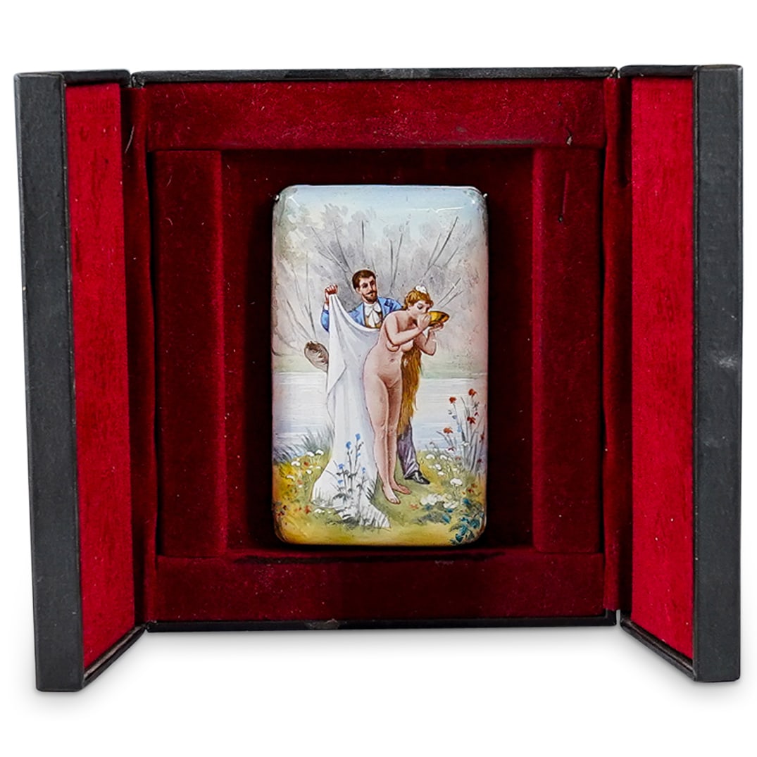 Antique Austrian Enameled Erotic Miniature Plaque: DESCRIPTION: Antique Austrian enameled erotic miniature plaque depicting a exterior scene with a nude maiden by the river, being covered with a large shawl by a young suitor. The plaque is attached to