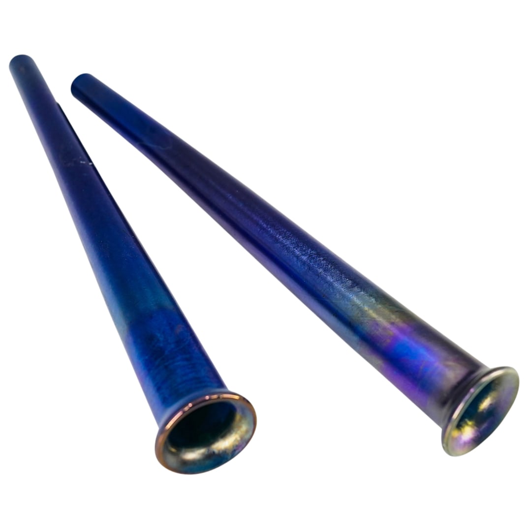 Pair Of Antique Louis Comfort Tiffany Blue Favrile Glass Tube Vases: DESCRIPTION: Two matching Louis Comfort Tiffany favrile glass tube vases, each crafted in a striking indigo tone and marked "L.C.T. Favrile" on underside. CIRCA: 1870s-1910s ORIGIN: USA DIMENSIONS: H: