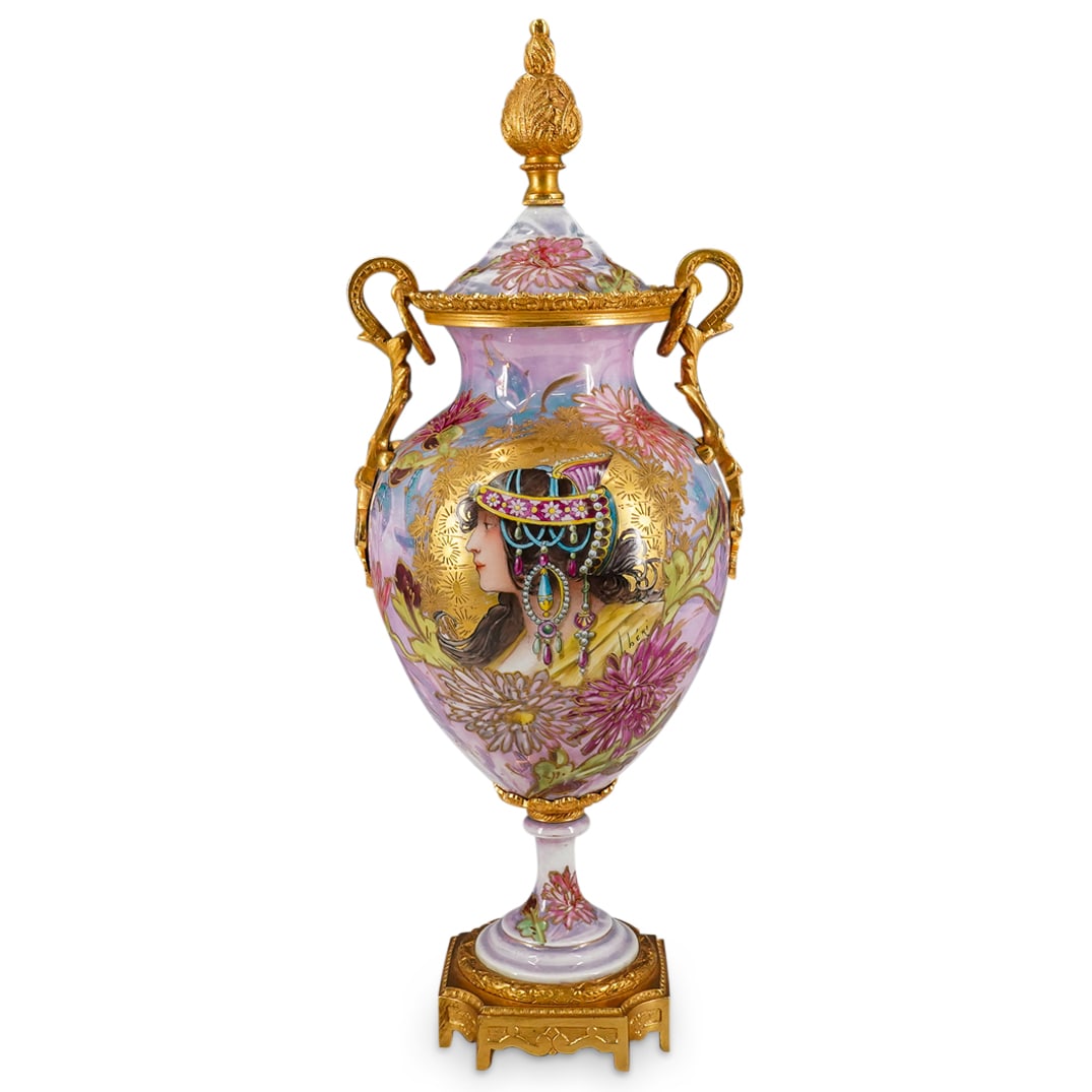 French Gilt Bronze & Enamel Porcelain Urn: DESCRIPTION: French porcelain urn, featuring hand painted enamel art nouveau stylized profile of a lady with a decadent headpiece on. Surrounded by pastel flowers and gilt detailing throughout. Gilt b