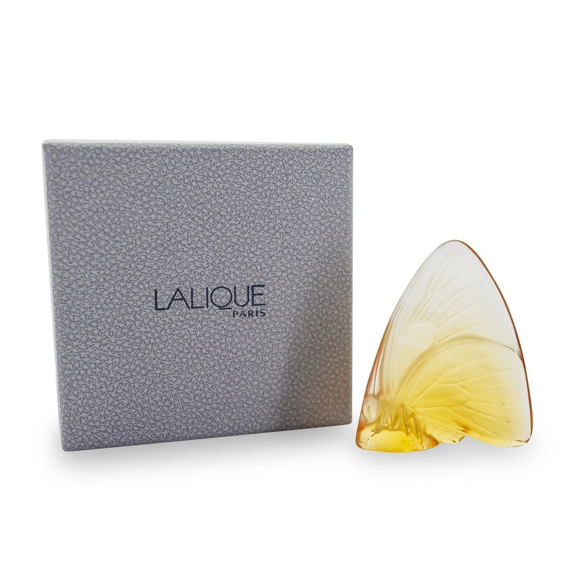 Lalique Crystal Butterfly Figurine: DESCRIPTION: Lalique crystal figurine of a butterfly in translucent amber color. Marked with traditional Lalique France signature hallmark. With Lalique box. CIRCA: 20th Century ORIGIN: France DIMENSI