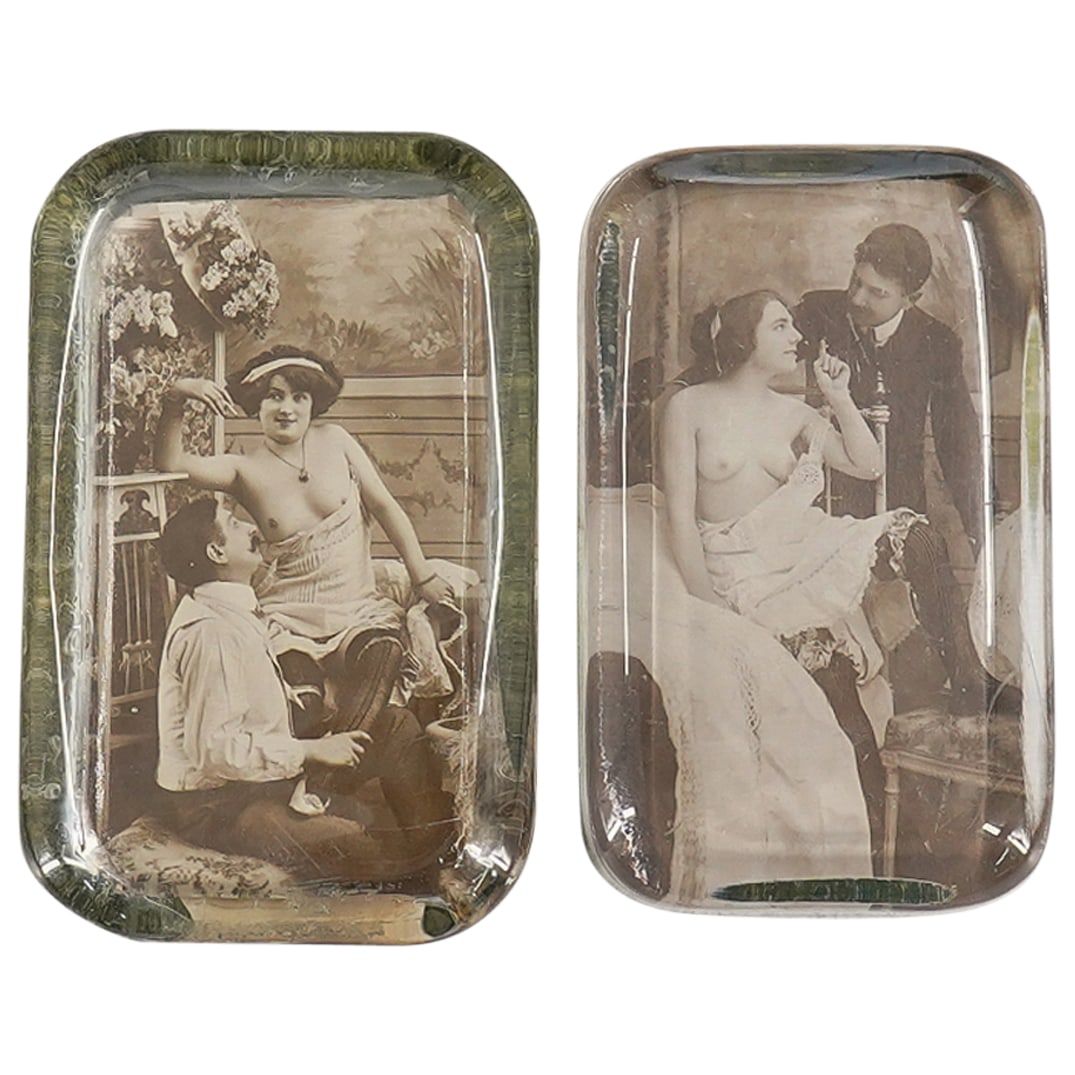 (2 Pc) Vintage Erotic Glass Paperweights: DESCRIPTION: Set of 2 vintage glass paperweights with erotic images within. One features a man looking up lovingly at a woman whom is seated with her dress at her midsection, she is smoking. The other