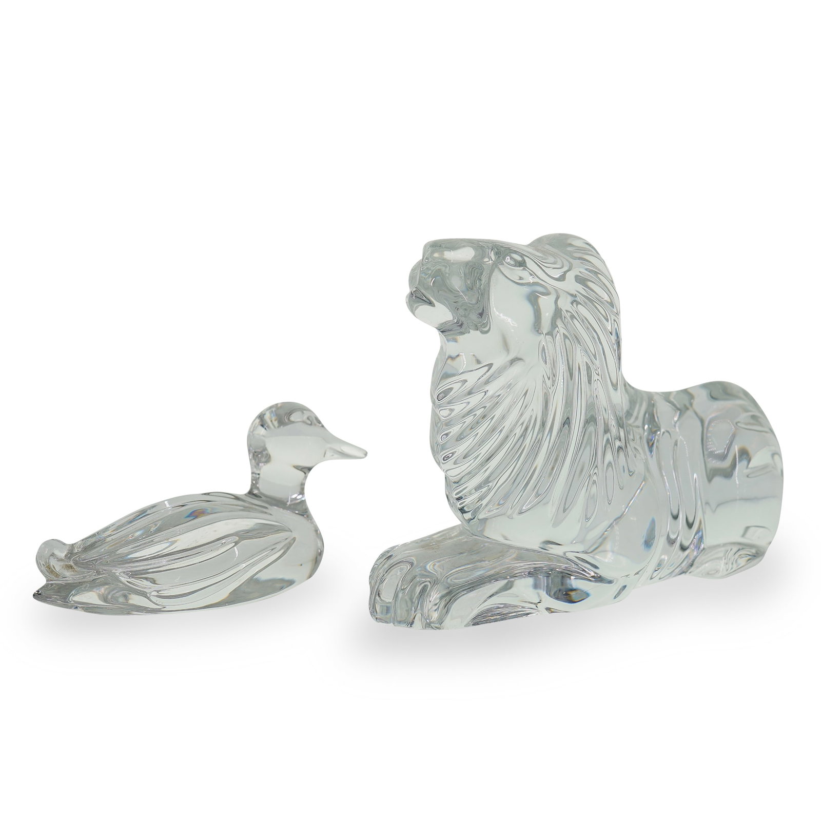 (2 Pc) Vintage Crystal Lion and Duck Figurines: DESCRIPTION: Vintage crystal figurines, featuring one carved reposed male lion underside stamped "Waterford". The other is a crystal figurine of a sitting duck. CIRCA: Late 20th - Early 21st Century O