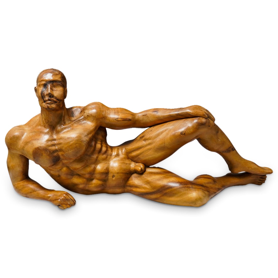 Large Reclining Nude Male Carved Wood Statue: DESCRIPTION: Carved wood statue depicting a reclining, muscular, nude man perching his left leg on his right, resting on his right elbow, and draping his left hand over his left knee. CIRCA: 20th Cent