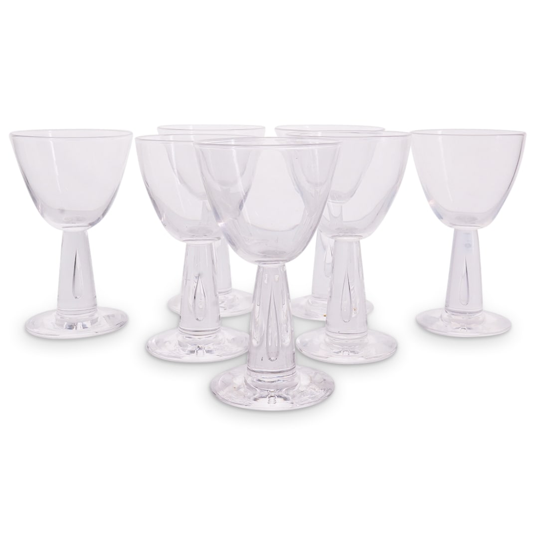 (7 Pc) Vintage Steuben Teardrop Stem Wine Glasses: DESCRIPTION: Set of 7 vintage Steuben wine glasses, featuring teardrop stem. Etched signature underside "Steuben" CIRCA: 20th Century ORIGIN: USA DIMENSIONS: H: 5" D: 3" CONDITION: Normal wear consist