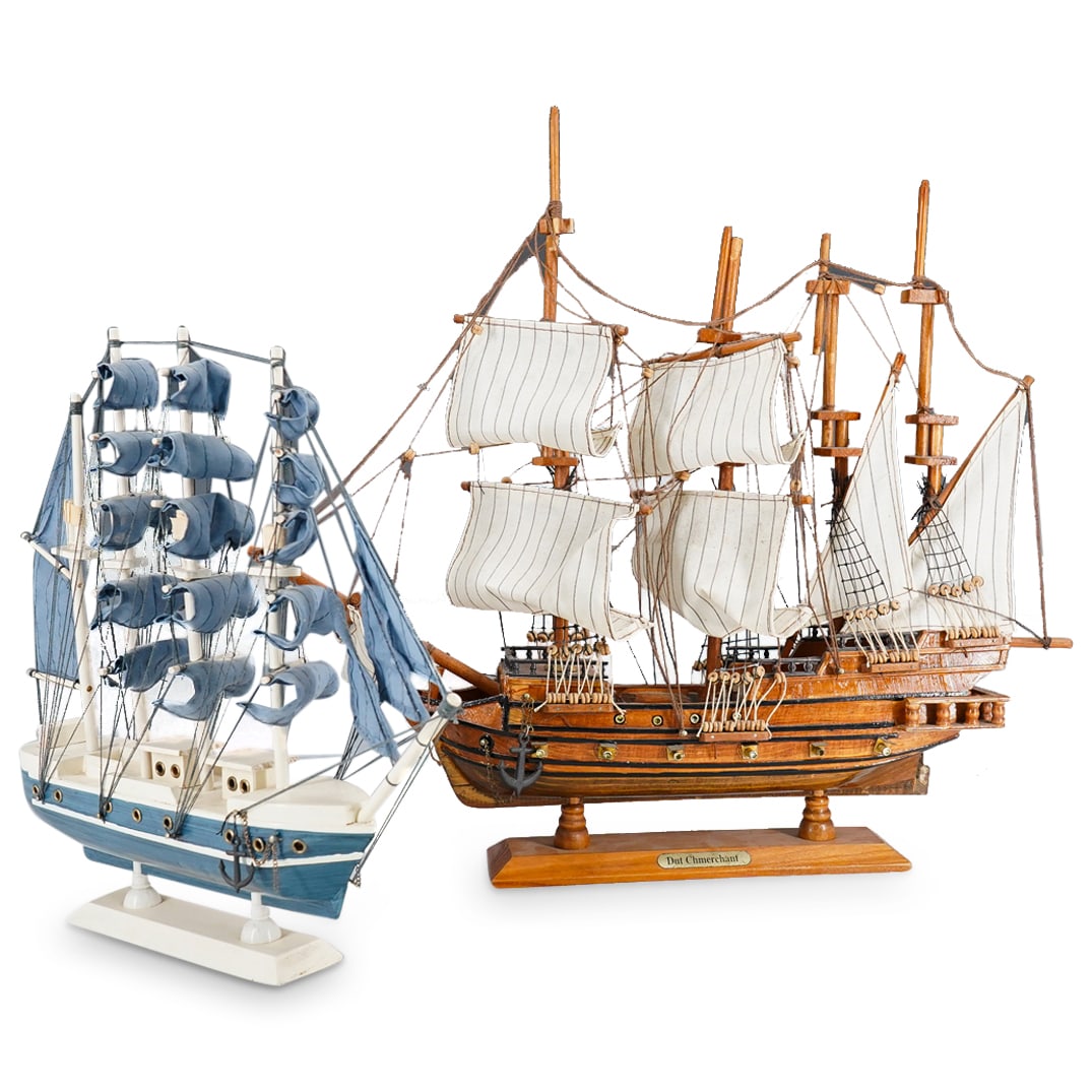 (2 Pc) Carved Wood Sailing Ship And Dutch Merchant Warship Models: DESCRIPTION: Two carved wood ship models - one blue and white sailing ship, one Dutch merchant warship - each featuring textile sails and miniature block and tackle throughout. Each piece is mounted t