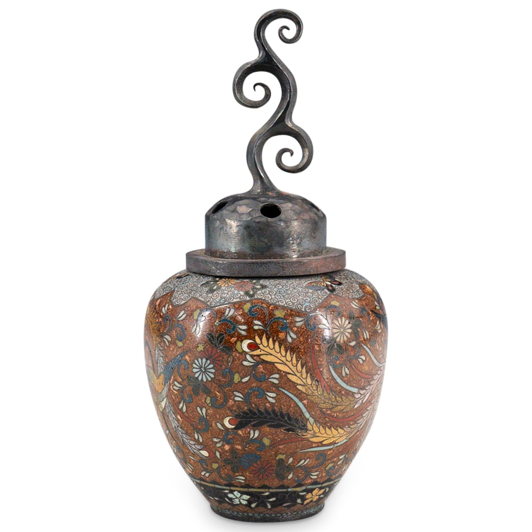 Antique Japanese Cloisonne Phoenix Jar: DESCRIPTION: Antique Japanese cloisonne jar, featuring goldstone ground, multi color enameled butterflies and phoenix with large wings. Top is hammered with holes and figural finial. CIRCA: 19th Centu