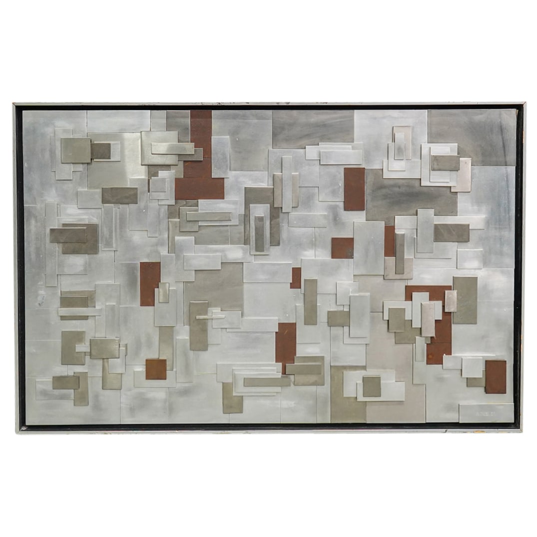 R. Dubner Geometric Mixed Metal Wall Sculpture: DESCRIPTION: Mixed metal wall sculpture featuring raised geometric motifs. Marked with "R. Dubner" at lower right. CIRCA: - ORIGIN: - DIMENSIONS: (Panel) H: 20" W: 30" (Frame) H: 21.25" W: 31" CONDITI