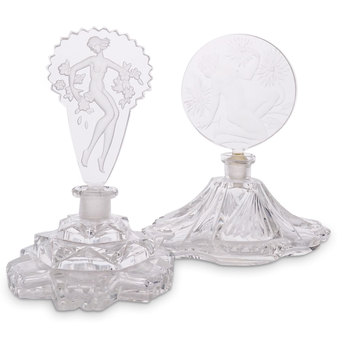 (2 Pc) Bohemian Czech Art Deco Glass Perfume Bottles: DESCRIPTION: (2 Pc) Bohemian Czech Art Deco glass perfume bottles, designed with cut glass bodies, and ornamental stoppers with intaglio motifs depicting female nude figures. CIRCA: 1930s ORIGIN: Czec