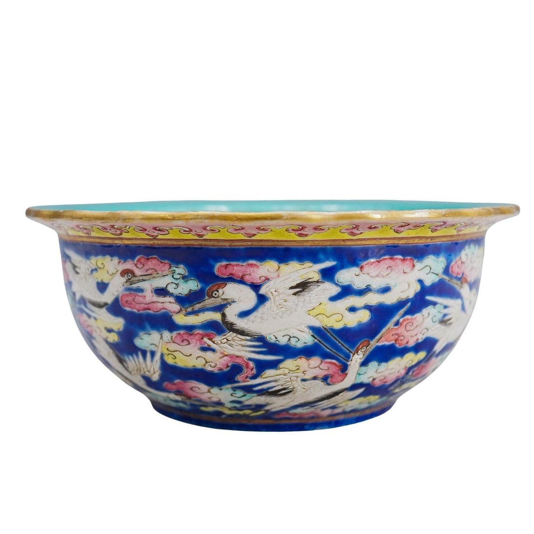 Antique Chinese Tongzhi Famille Rose Porcelain Bowl: DESCRIPTION: Antique famille rose porcelain bowl featuring a continuous scene on its exterior of cranes among clouds against a blue background bordered above by a pink and yellow lingzhi (ganoderma mu