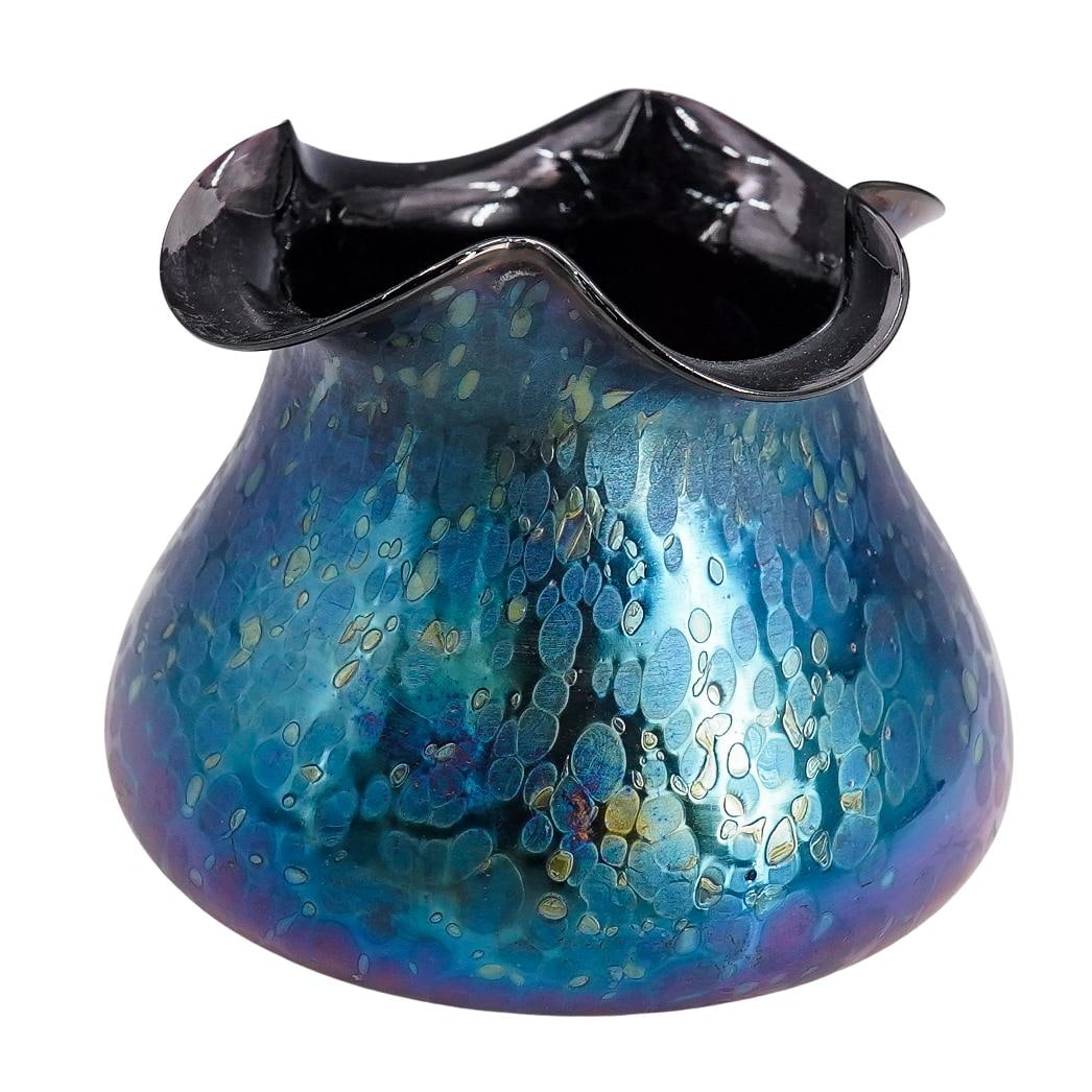 Wilhelm Kralik Art Nouveau Iridescent Blue Oil Spots Glass Vase: DESCRIPTION: Wilhelm Kralik art nouveau iridescent blue and sapphire oil spots glass vase featuring ruffled trim. CIRCA: Early 20th Century ORIGIN: DIMENSIONS: H: 5.25" W: 6.5" L: 6.5" CONDITION: Good