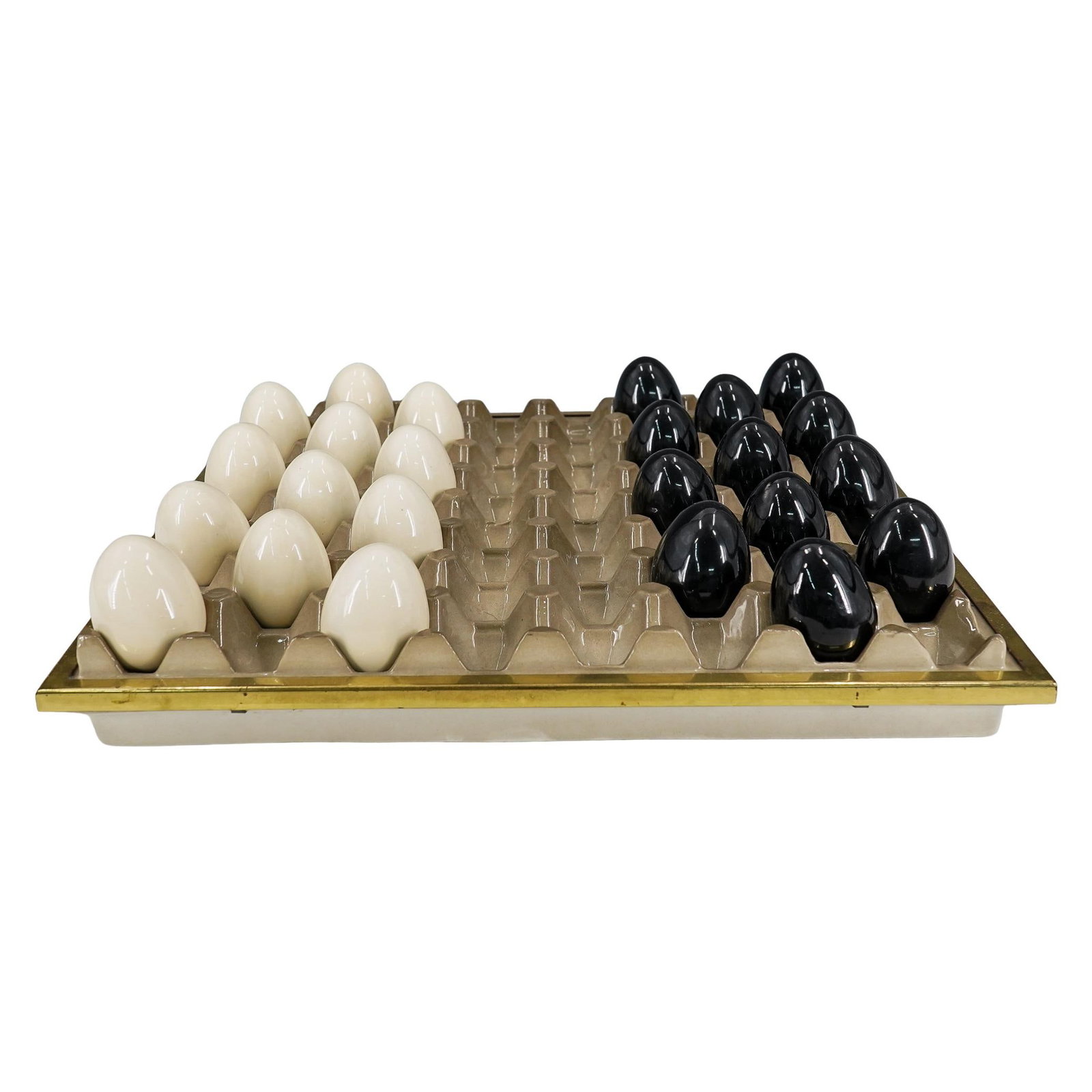 Mid Century Modern Porcelain And Brass Egg Tray Checkers Game: DESCRIPTION: Mid-century modern porcelain checkerboard crafted as an egg tray with matching black and white egg pieces and sporting gilt brass trimming around the edge. Each moveable space is fitted w