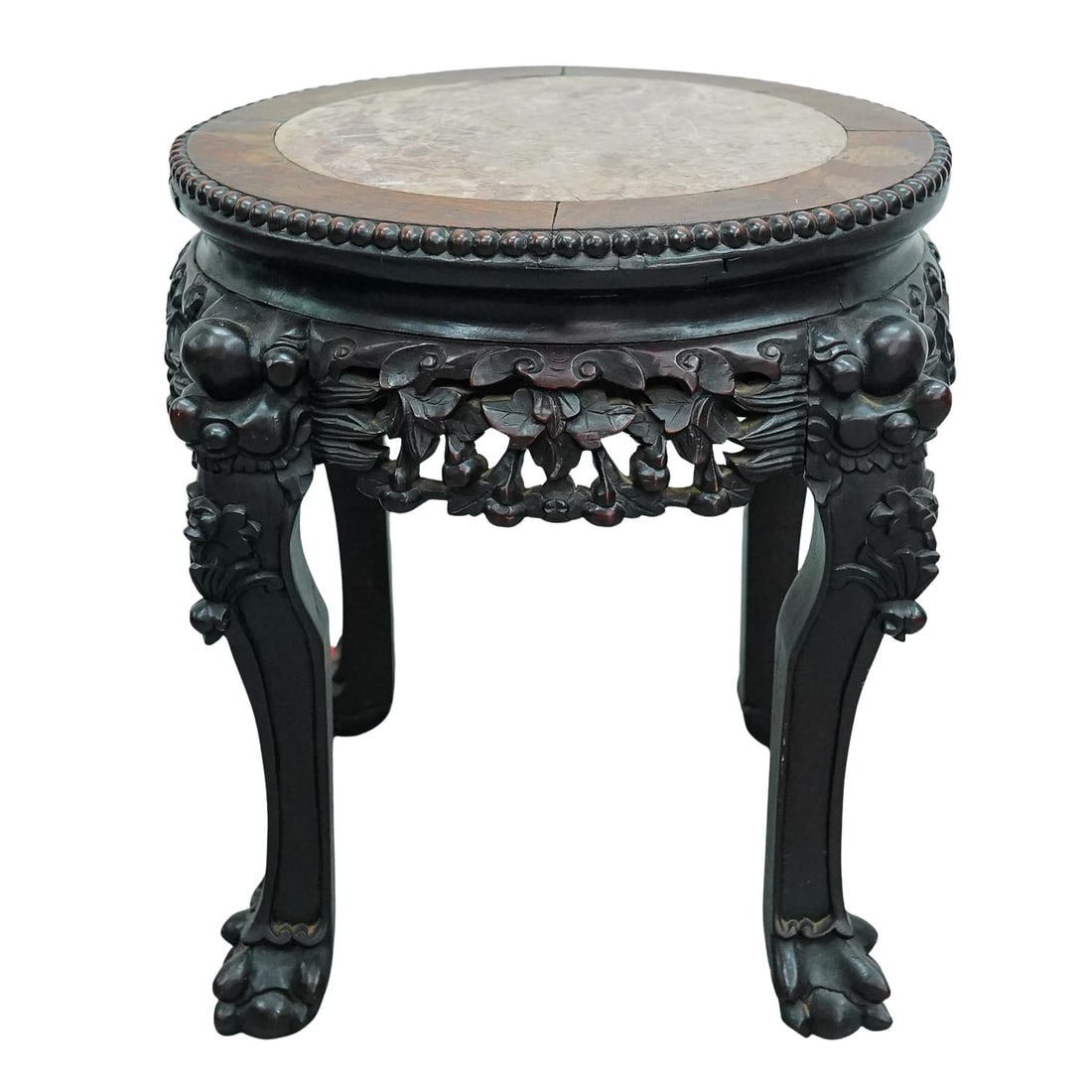 Chinese Marble & Wood Stand: DESCRIPTION: Chinese wooden stand or table featuring marble top, carved floral, foliage, and beast motifs, openwork, and four ball and claw feet. CIRCA: Early 20th century ORIGIN: Chinese DIMENSIONS: 
