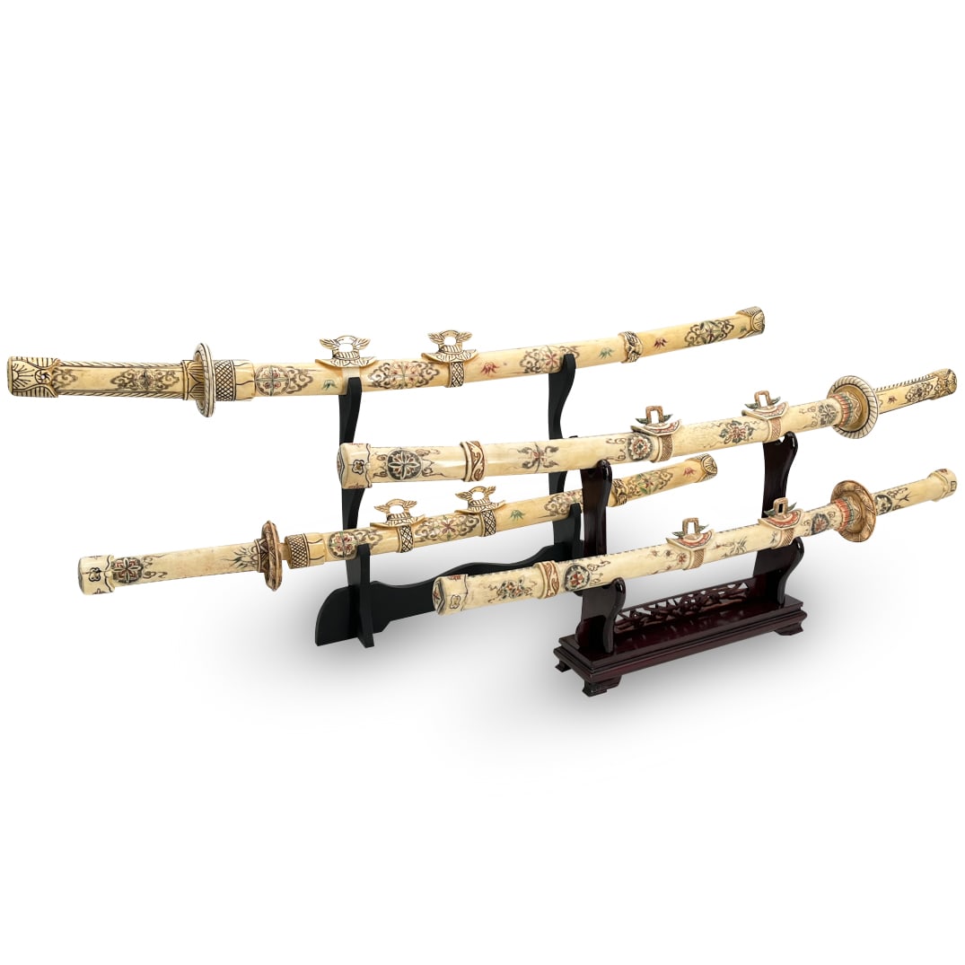 (4 Pc) Sino Japanese Tessellated Carved Bone Katana Swords: DESCRIPTION: Four tessellated carved bone sculptures, each depicting a katana sword sheathed in a scabbard ornately decorated with floral, foliage, and geometric motifs and patterns. Includes carved w