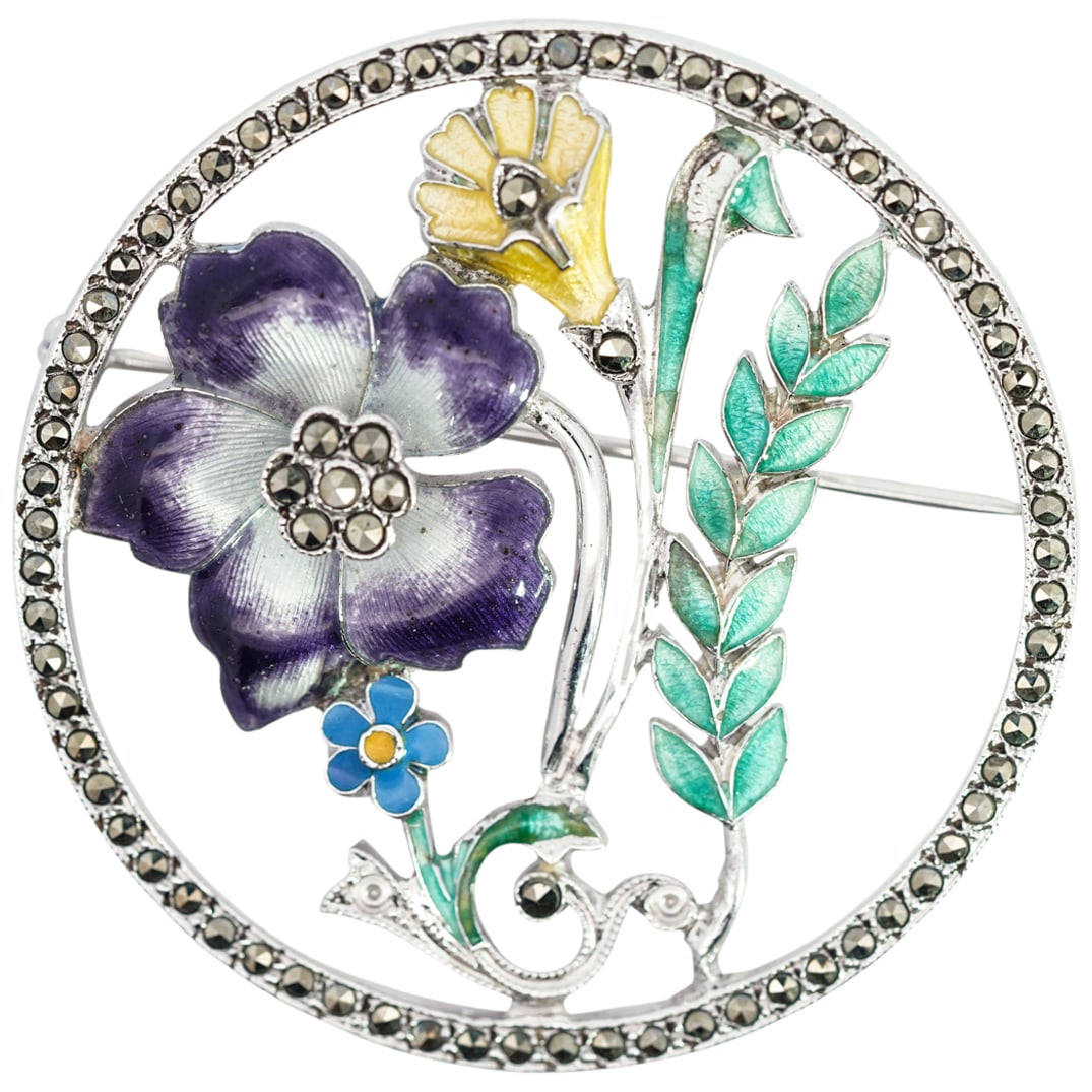 Art Nouveau Sterling Silver & Enamel Floral Brooch: DESCRIPTION: Art nouveau sterling silver brooch, featuring guilloche enamel flowers in purple, yellow, lavender, and green. Marcasite stones line the border and accent the flowers. Stamped "STERLING" 