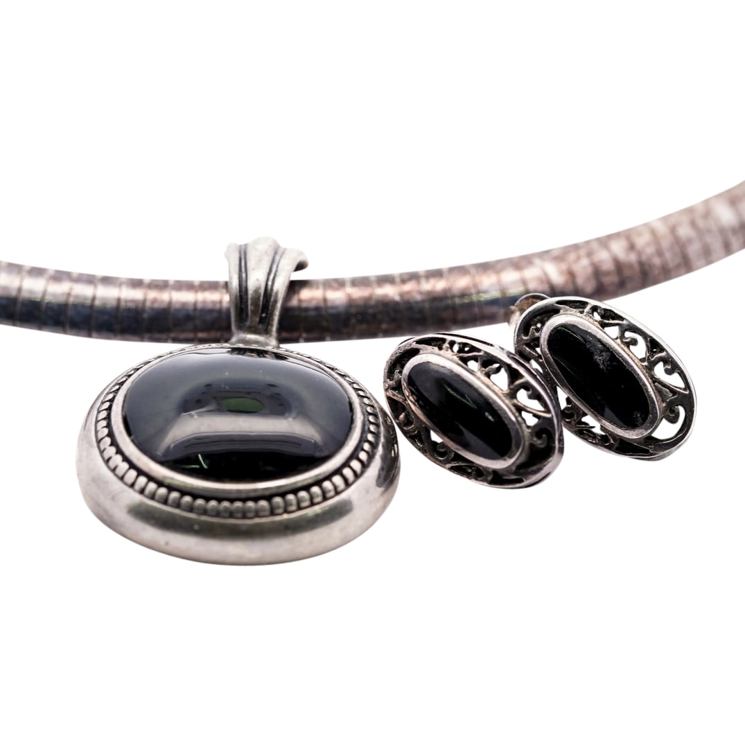 Vintage Mexican Sterling Silver & Onyx Necklace and Earrings: DESCRIPTION: Vintage sterling silver domed omega chain, stamped "925 Italy" featuring an oval shaped sterling silver and onyx pendant, marked "ATI925 Mexico" with silver open filigree earrings that ha
