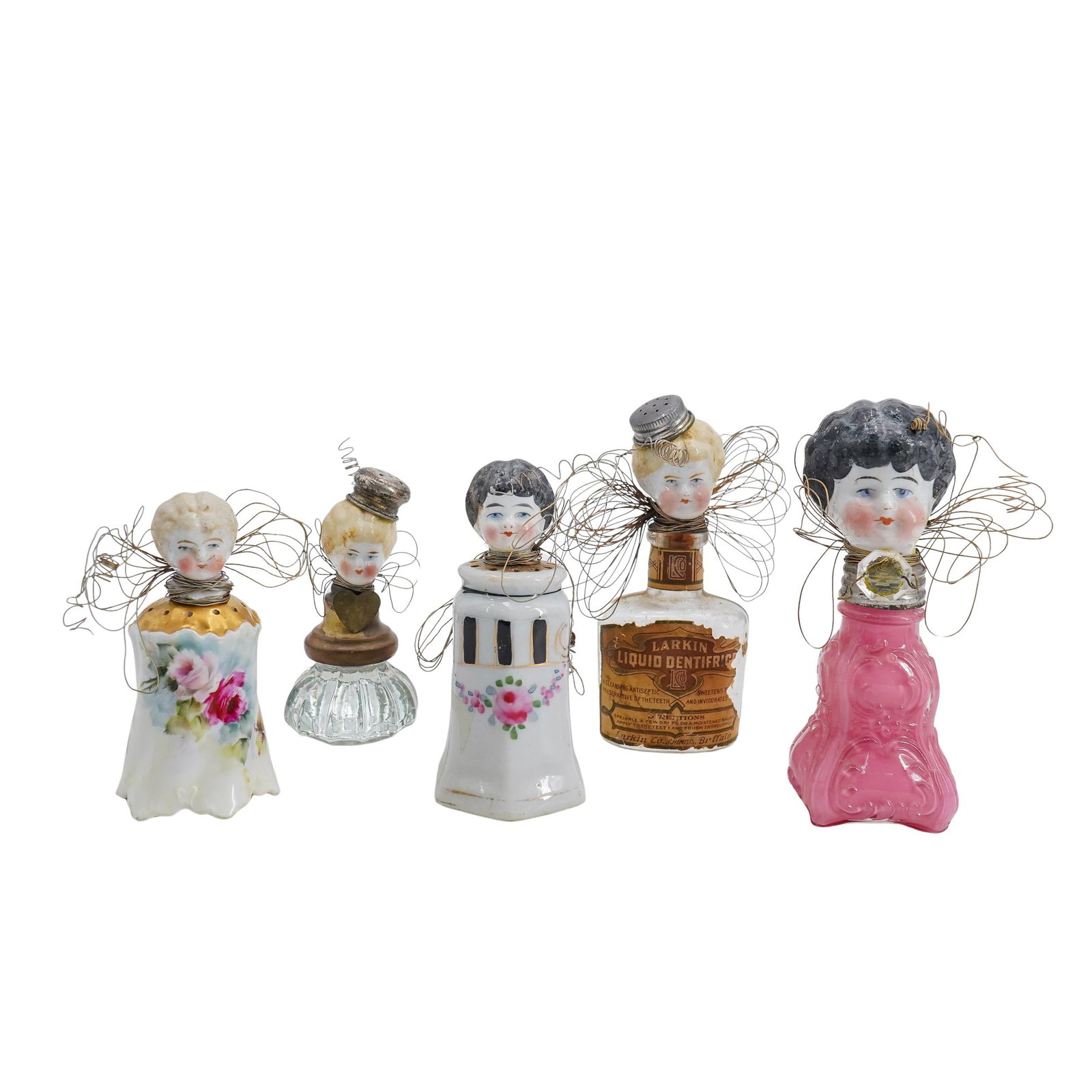 (5 Pc) Tin Lizzy Folk Art Vintage Doll Assemblages: DESCRIPTION: Set of 5 folk art vintage doll assemblages by artist Tin Lizzy (Betsy Wilbur) Featuring porcelain doll heads, attached to various objects. Such as, vintage salt and pepper shakers, crysta