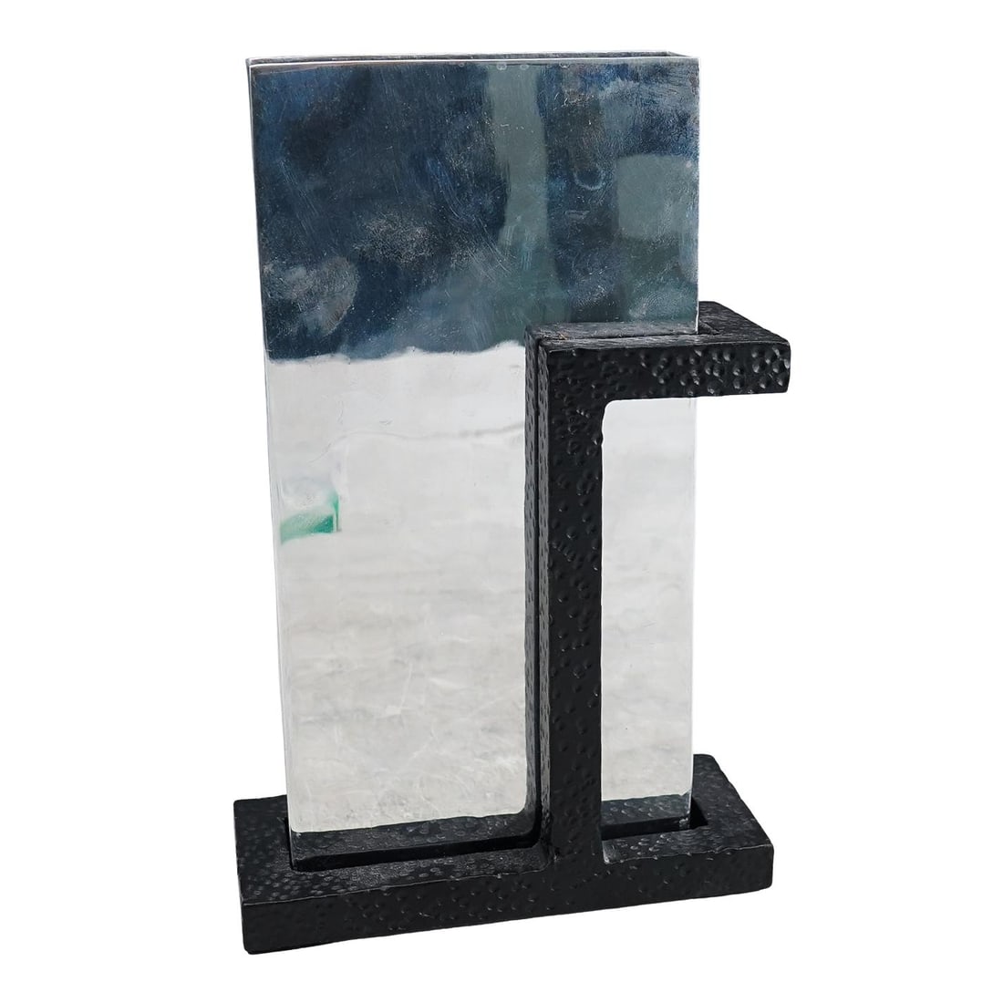 Michael Aram Chrome & Iron Vase: DESCRIPTION: Michael Aram floral vase designed with a rectangular form in chrome supported on a black latinate iron vase. Signed on underside. CIRCA: 21st Century ORIGIN: USA DIMENSIONS: H: 8 1/4" W: