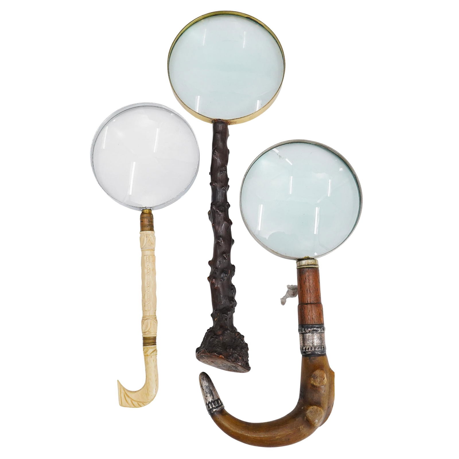 (3 Pc) Antique Magnifying Glasses: DESCRIPTION: Set of 3 vintage magnifying glasses. One featuring horn, wood, and silver handle H: 10" L: 6", another featuring painted wooden branch handle H: 12.25" L: 4", and last featuring carved bo