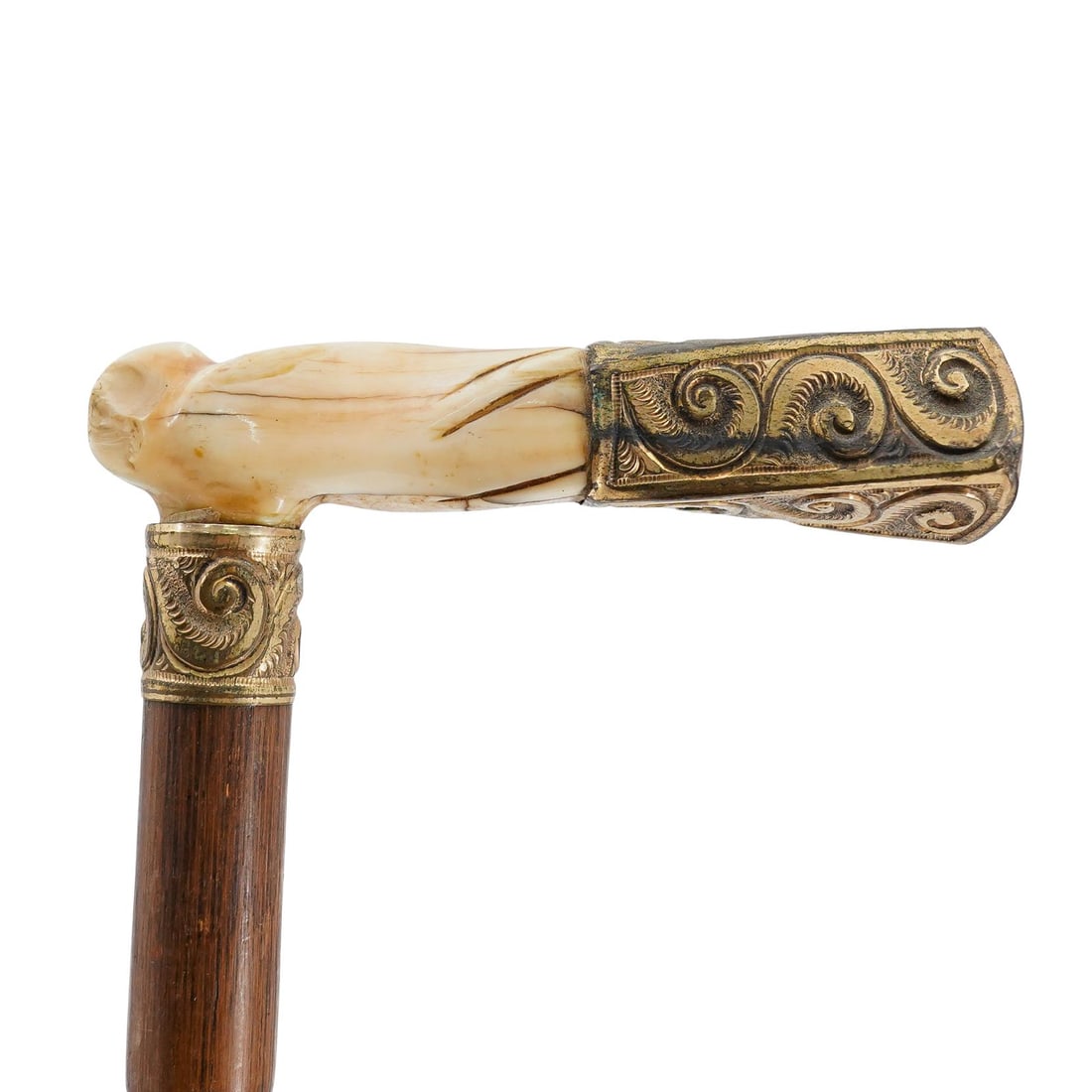 Antique Bone and Bamboo Cane: DESCRIPTION: Antique cane featuring carved bone handle with gilt trim and tip that has etched filigree. The shaft consists of bamboo CIRCA: Early 20th Century ORIGIN: USA DIMENSIONS: H: 38.25" Handle 