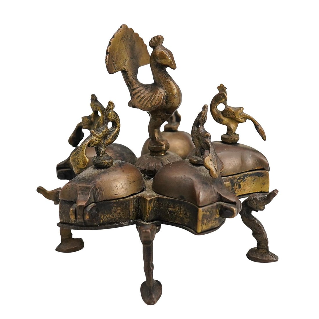 Vintage Brass Peacock Kumkum Box: DESCRIPTION: Vintage Brass Kumkum Box with five compartments depicting peacock finials. Handcrafted in India. Designed with five separate lidded compartments which are kept firmly closed by a single t