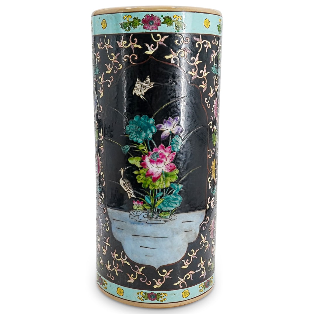 Chinese Famille Noire Porcelain Umbrella Stand: DESCRIPTION: Chinese famille noire porcelain umbrella stand decorated with flowers and foliage, one side depicting two cranes near a lotus blossom, the opposite side depicting a bird perched in a flow