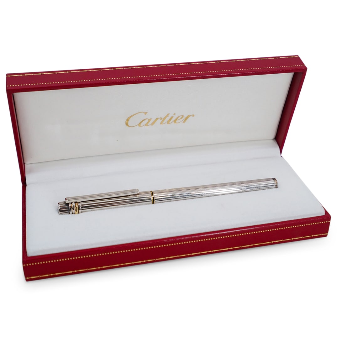 Cartier 18k Gold Must De Plume Pen: DESCRIPTION: Cartier plume "M" must pen, featuring silver pen with 18k gold and silver rope like design on cap. 18k gold tip, hallmarked. Includes box, ink transfer, and certificates. CIRCA: 20th Cent