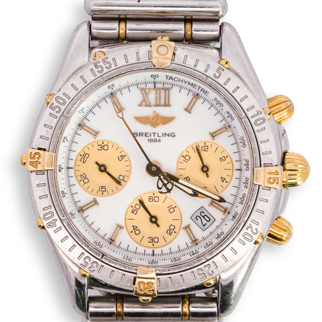 Breitling Stainless Steel & 18k Gold Jetstream Watch: DESCRIPTION: Breitling stainless steel and 18k yellow gold Jetstream watch, featuring quartz movement, white enamel dial with applied gold tone stick markers and gold sub dials. The case is stainless