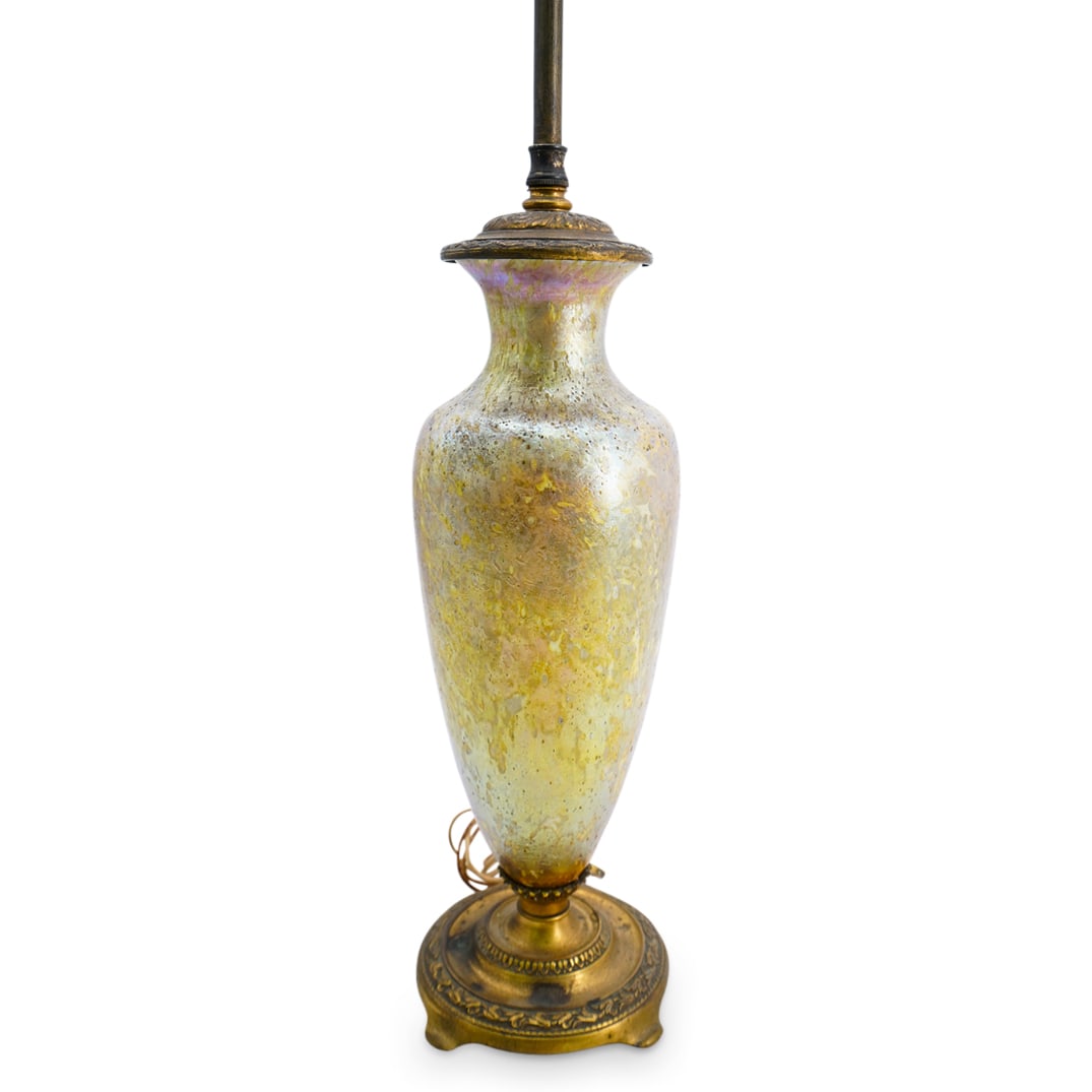 Tiffany Cypriote Favrile Glass Lamp: DESCRIPTION: Tiffany Cypriote yellow favrile glass etched signature at bottom "Louis C Tiffany Favrile" on gilt bronze base and gilt bronze fixture and finial. Base stamped "Cassidy Co Inc New York" C