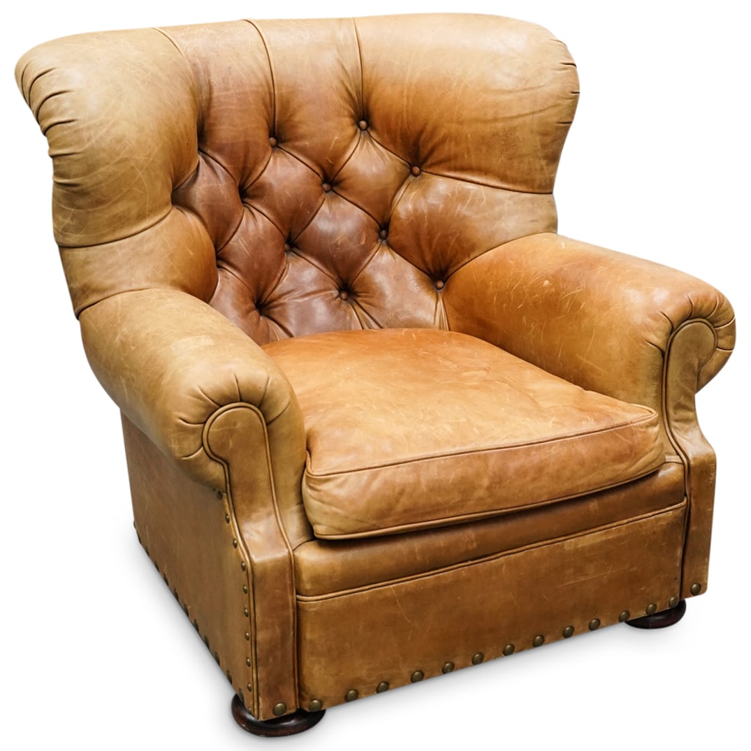 Ralph Lauren Saddle Leather Armchair: DESCRIPTION: Ralph Lauren Western saddle leather armchair with tufted and studded design. Ralph Lauren blue label at underside. CIRCA: 20th Cent. ORIGIN: Continental DIMENSIONS: H: 35.5" x W: 40" x L: