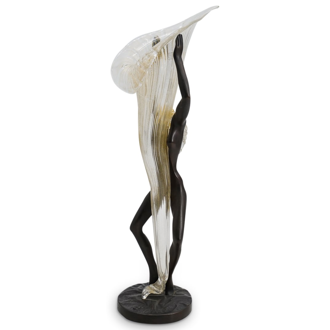 Gilbert Kruft (German, 1939-2015) Bronze Vase: DESCRIPTION: Gilbert Kruft (German, 1939-2015) bronze vase titled: "Salome" Features a nude bronze figure, centered by a winding hand blown Murano glass lily with gilded sparkled accents. Marked with 