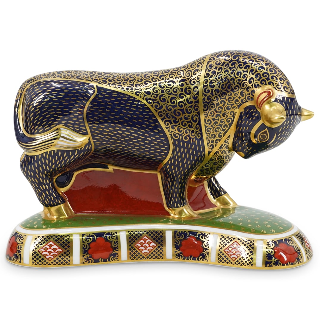 Royal Crown Derby Bull Paperweight: DESCRIPTION: Royal Crown Derby paperweight, modeled after a Grecian bull. Decorated in the Imari pattern with gilt accents. Marked underside "Royal Crown Derby English Bone China" CIRCA: 20th Century