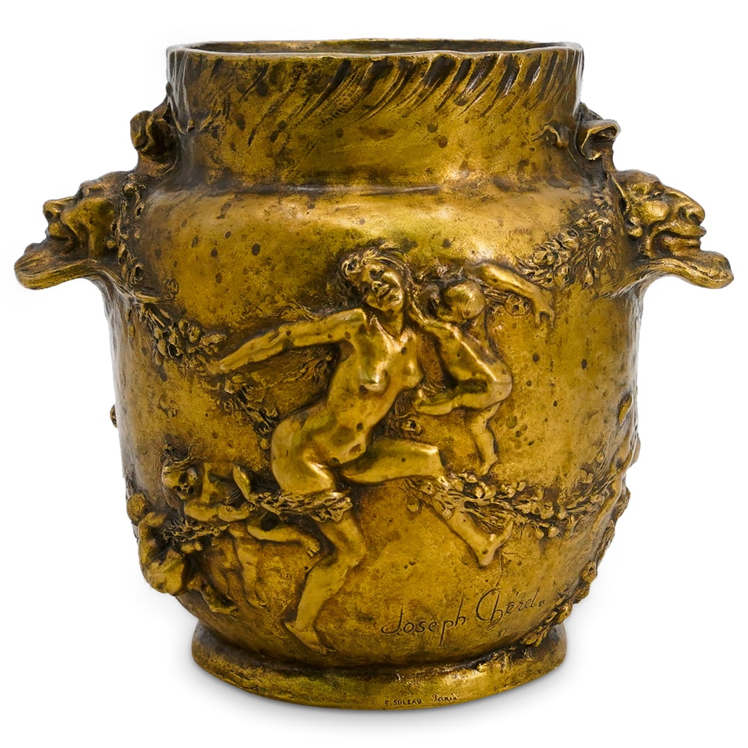 Joseph Cheret (French, 1838-1894) Art Nouveau Gilt Bronze Vase: DESCRIPTION: Joseph Cheret (French, 1838-1894) Art nouveau gilt bronze vase, featuring nude women and cherubs along vines of flowers in relief. Two figural face handles on either side. Signed "Joseph 